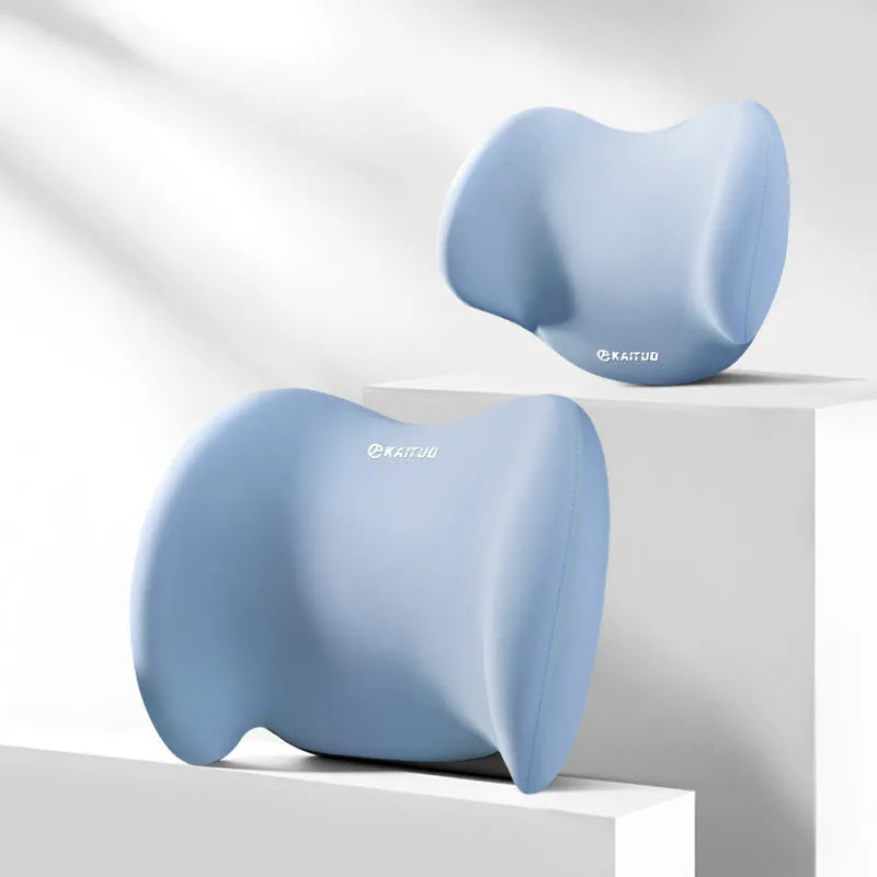 Grey geometric-patterned car headrest pillow and lumbar support cushion set on a car seat.