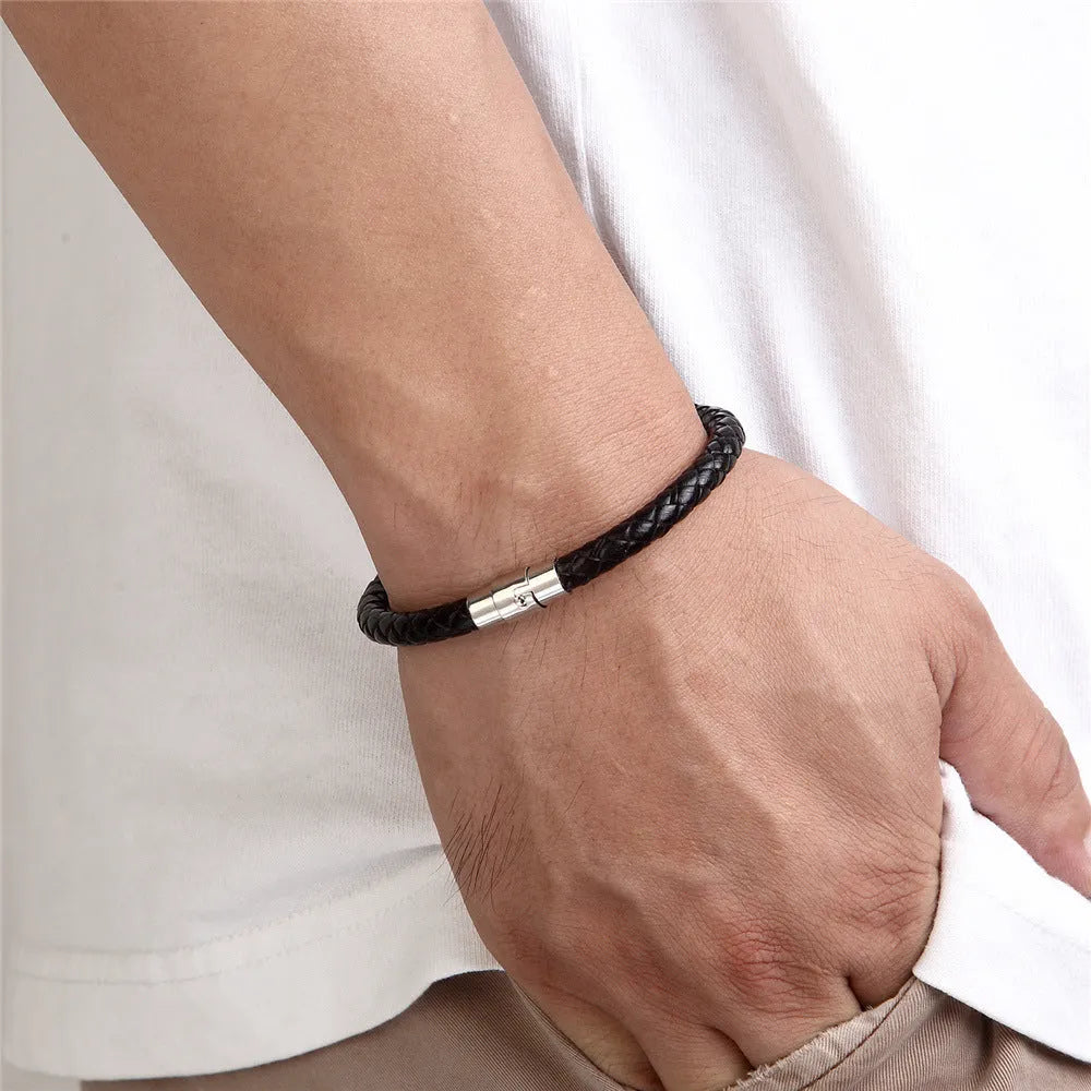 Geometric line design titanium steel bracelet with magnetic clasp on a wrist, showing adjustable sizing.