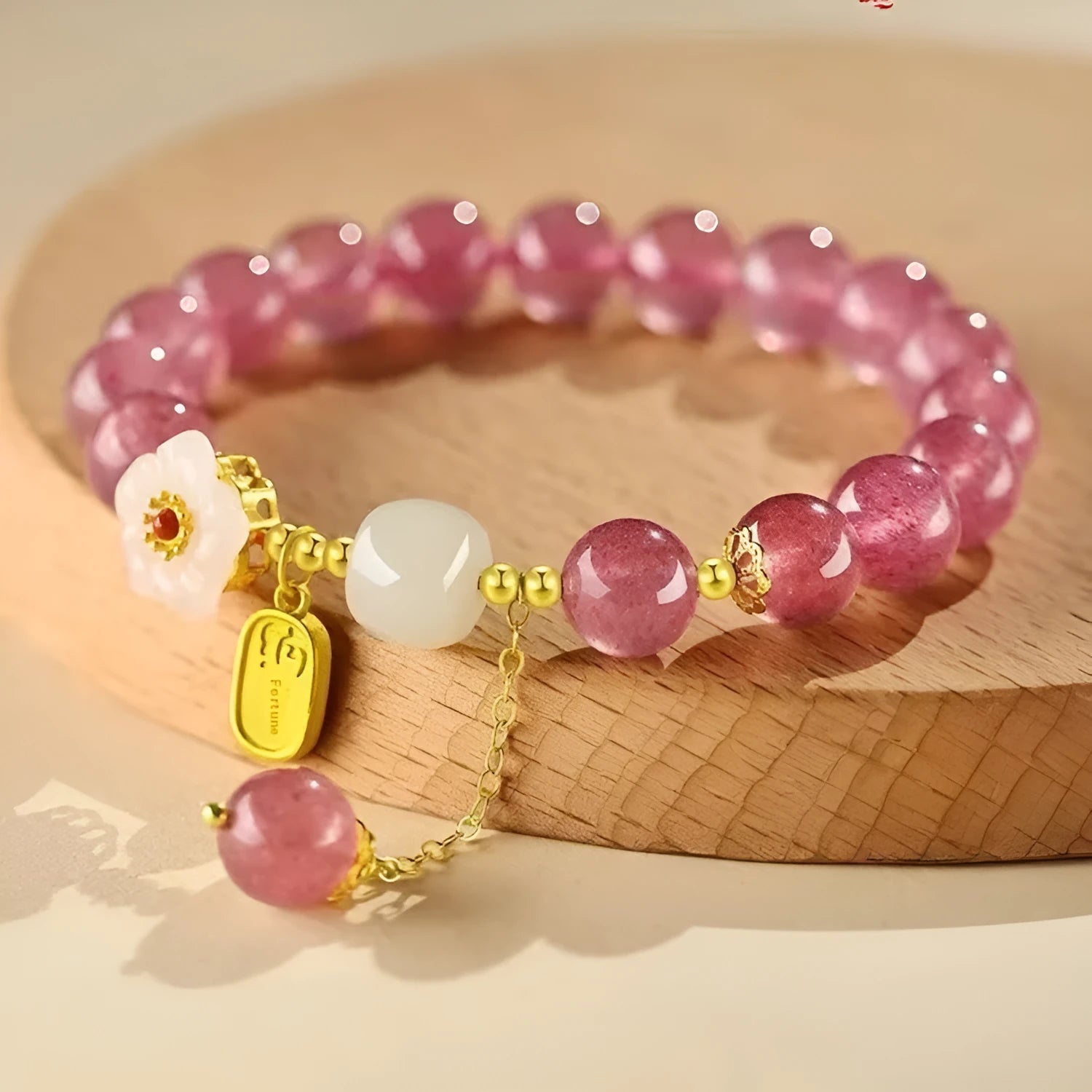Handmade strawberry quartz crystal bracelet for women showing green strawberry quartz moon design.