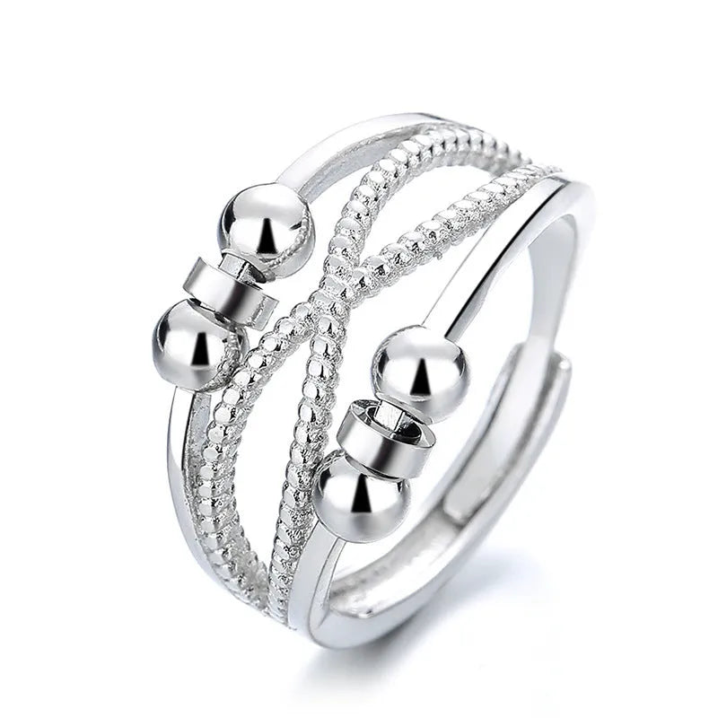 Rotatable copper ring with open design double-layered hollow line construction in platinum colour geometric shape