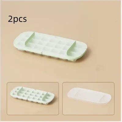 A high-capacity blue ice cube tray with a leverage-action lid and a stored ice shovel.