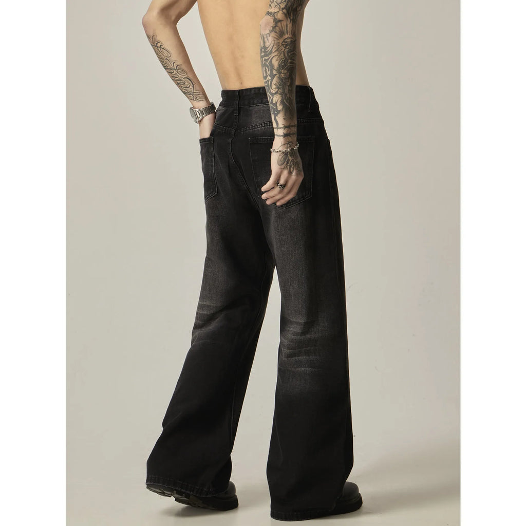 Black American retro loose straight jeans with zip fly opening on denim background