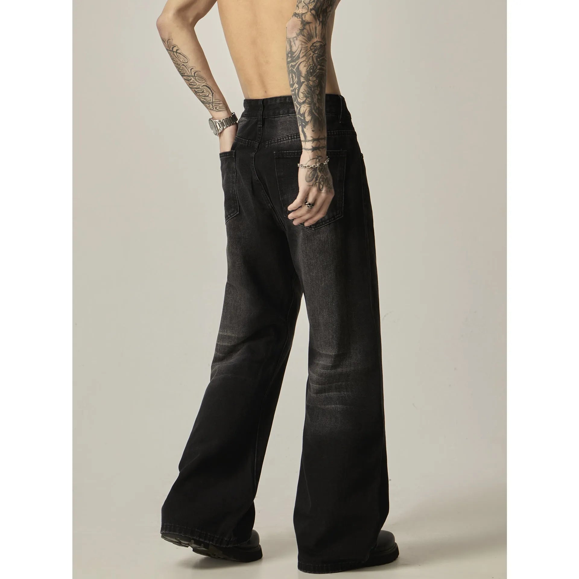 Black American retro loose straight jeans with zip fly opening on denim background
