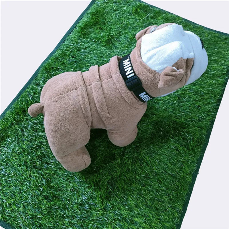 Green washable dog grass pee training mat with realistic lawn texture on a patio.