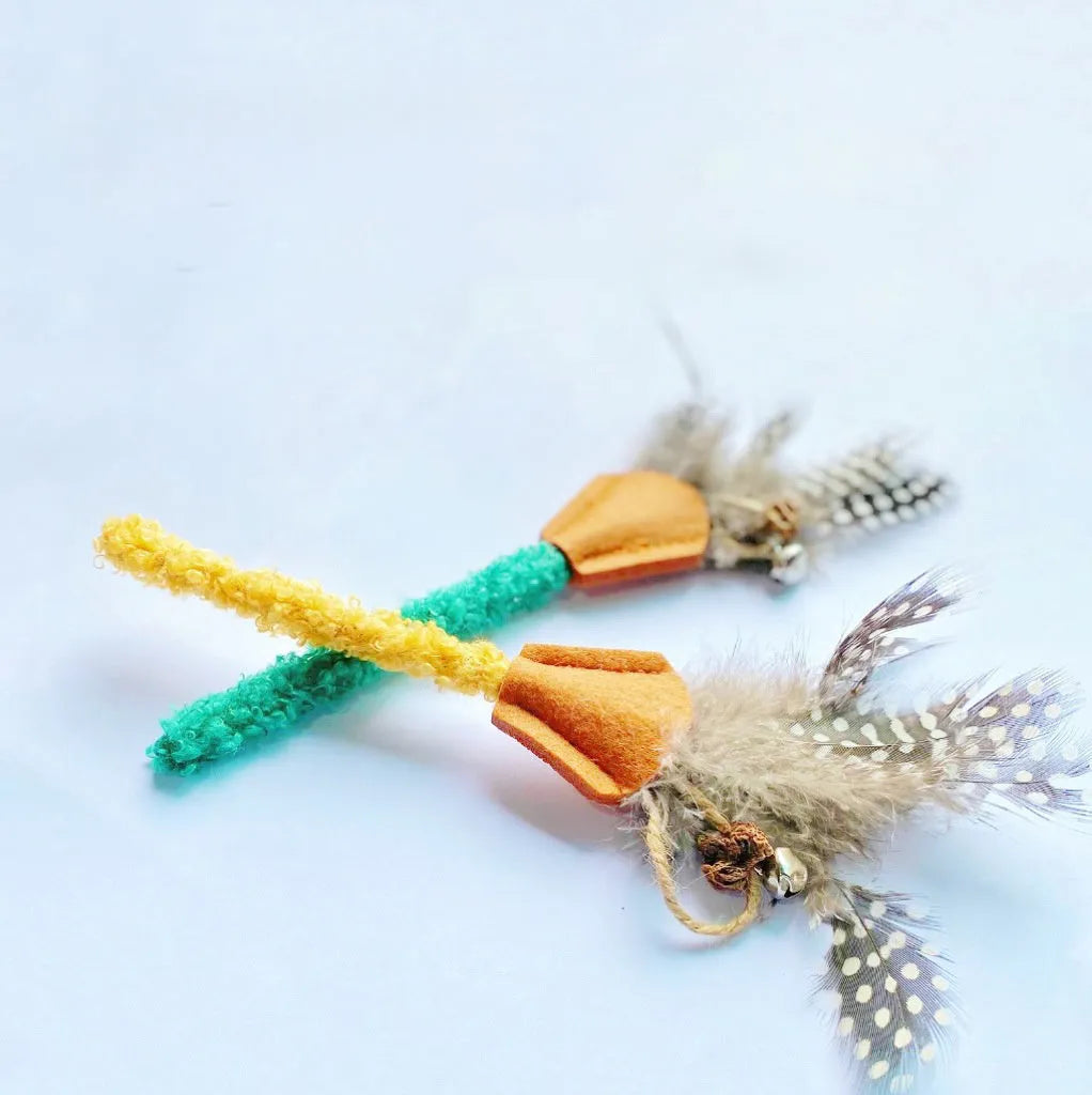 Four polygonum wood cat chew sticks with gall fruit texture in green and yellow colours