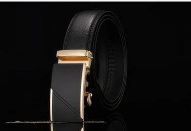 Men's two-layer cowhide belt with gold alloy automatic buckle on a flat surface