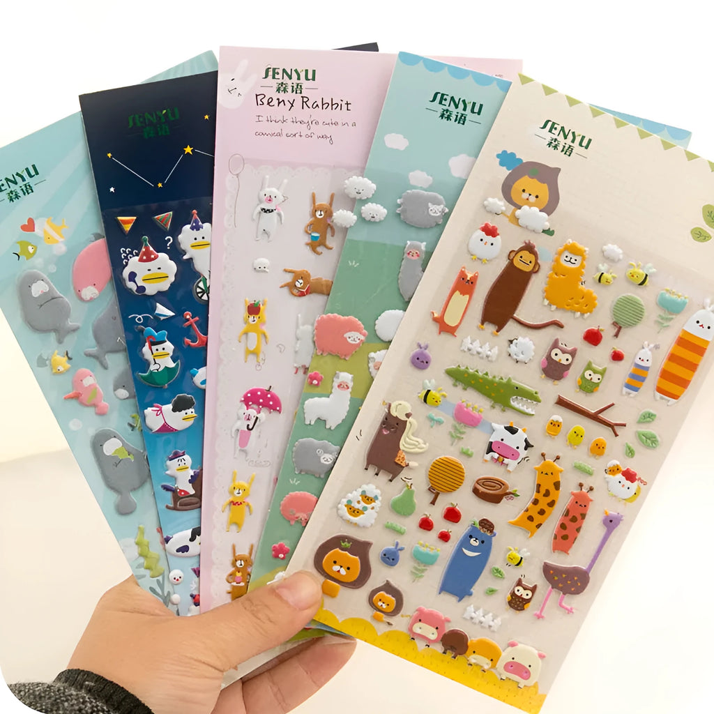 Sheet of cartoon-themed three-dimensional bubble stickers with raised surfaces on various designs like an alpaca, dinosaur, and bow tie cat.