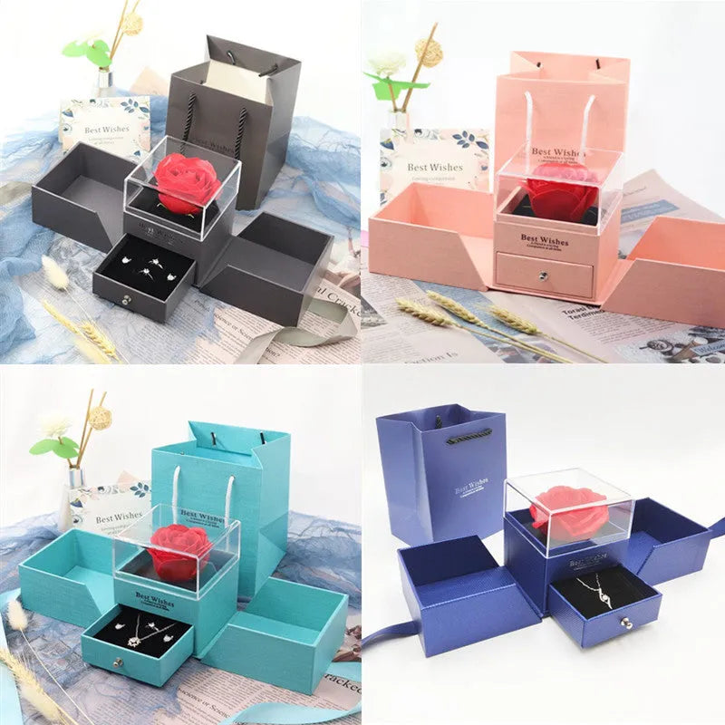 Blue jewellery gift box with a white plastic eternal flower on the lid