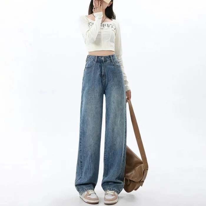 Woman wearing high-waisted retro blue wide-leg denim jeans with a straight cut.