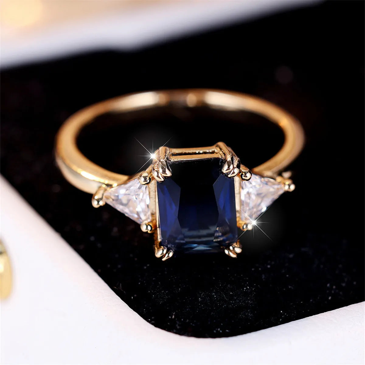 Rectangular gold sapphire blue copper ring for women showing geometric design