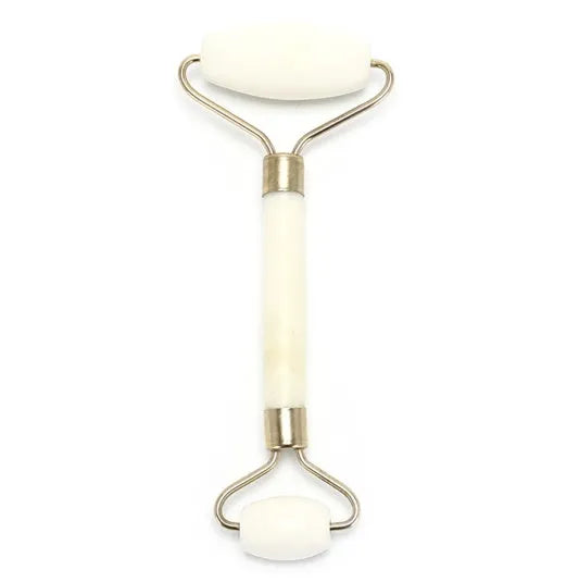 Natural jade facial massage roller on a light background showing smooth green stone and handle