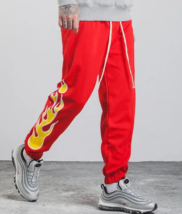 Hop flame print joggers for men and women in black, loose fit cotton blend sweatpants with red, blue flame pattern