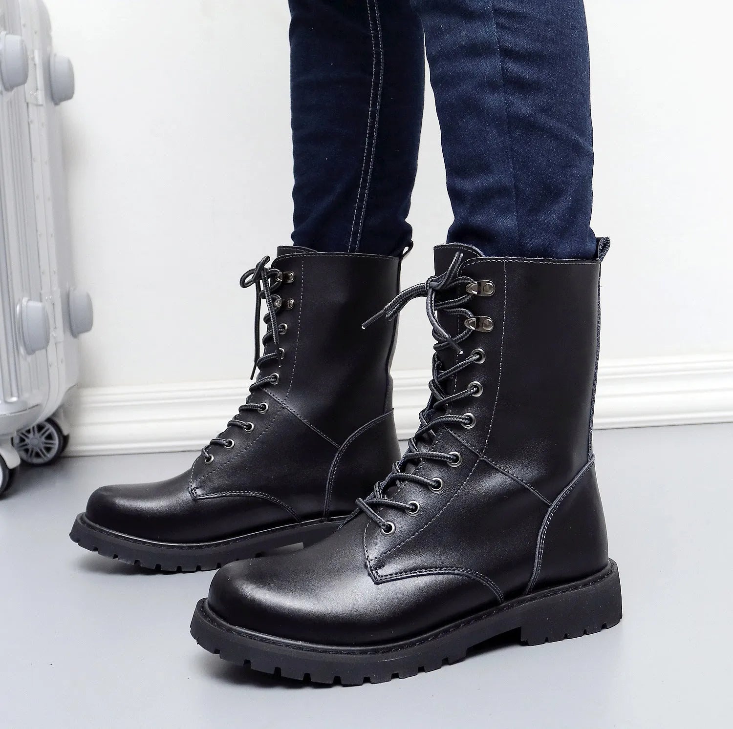 Winter high top men's leather military boots with fleece lining and front tie closure in black and brown