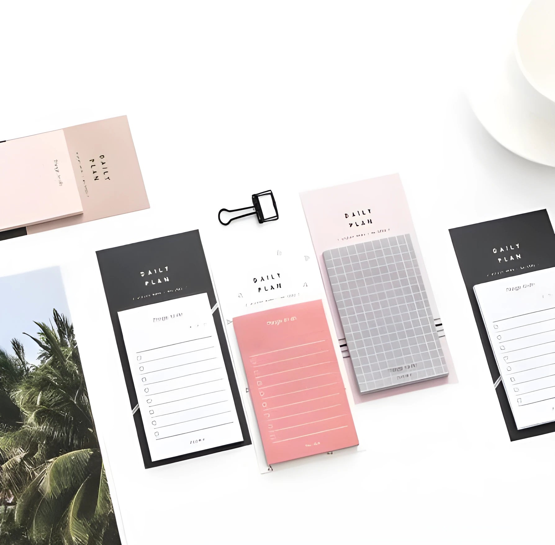 Pink and red schedule planning notepads showing 10cm by 6cm size and 80g paper.