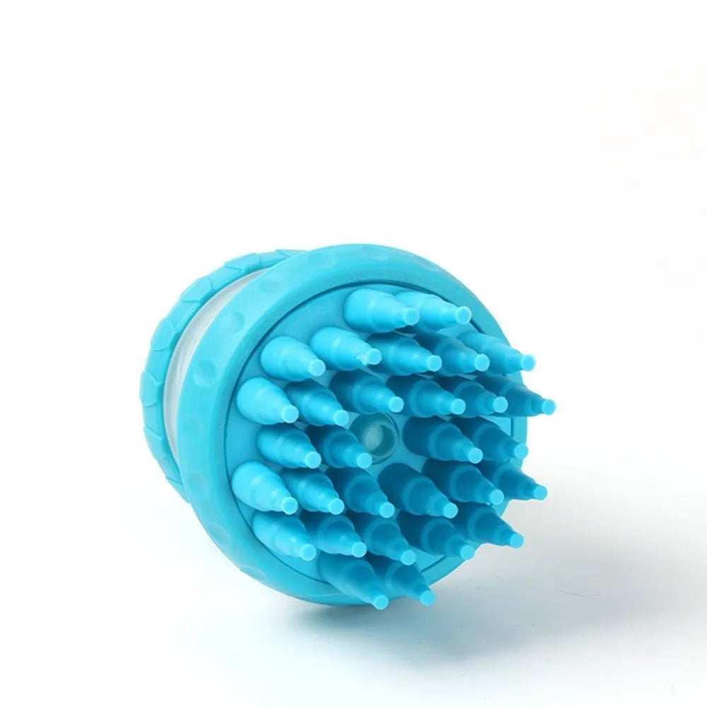 Silicone dog washing brush with built-in shampoo reservoir in blue on a white background