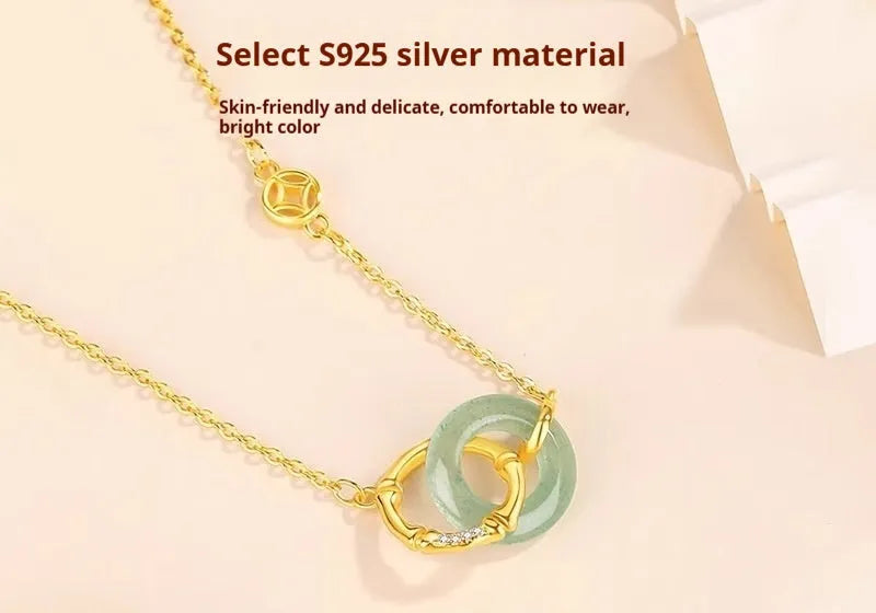 Sterling silver bamboo buckle necklace on geometric O-ring chain, showing adjustable length and pearl detail.