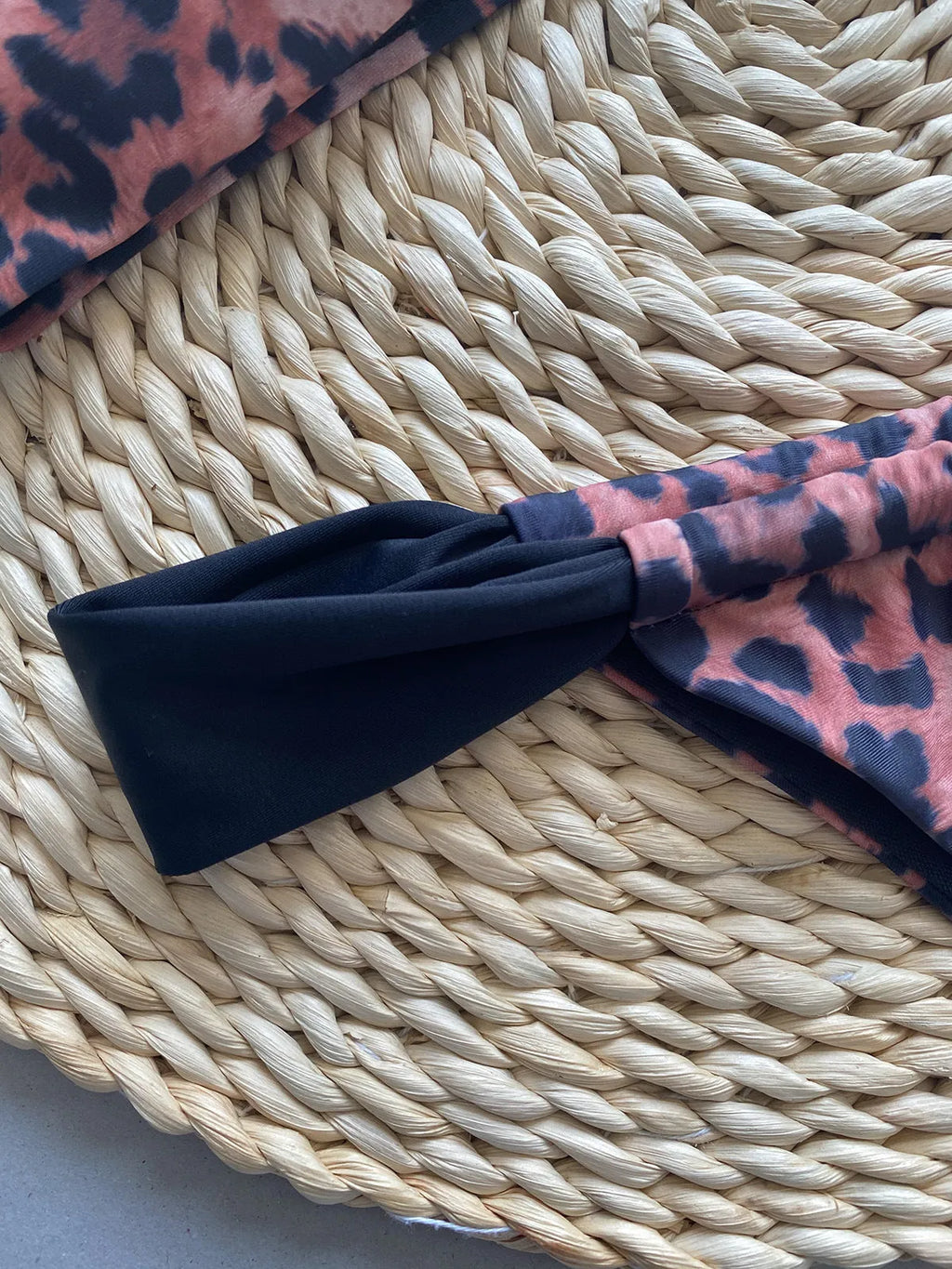Women's leopard print bikini with tube top and split bottoms in black or leopard pattern