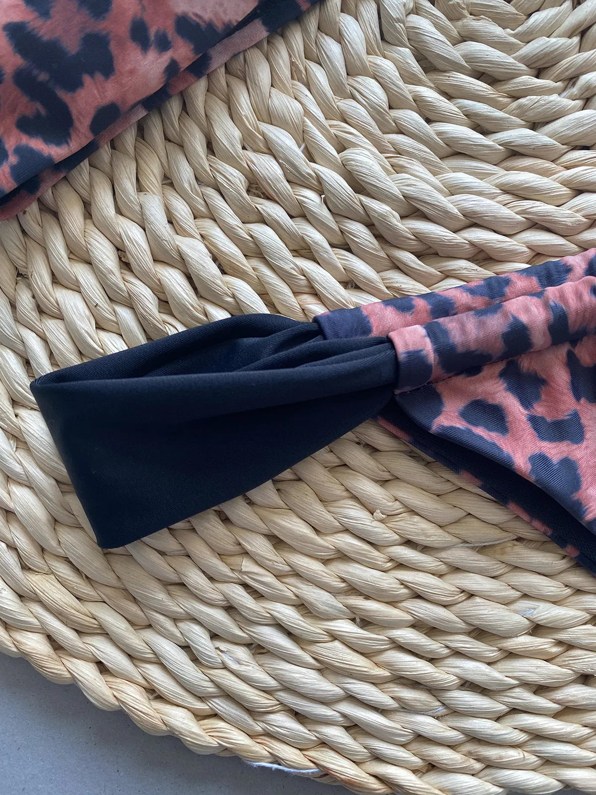 Women's leopard print bikini with tube top and split bottoms in black or leopard pattern