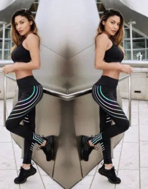 Women's black workout leggings with a glowing print pattern on the legs.