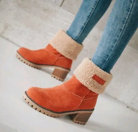 Women's chunky heel mid-calf suede snow boots in green, shown on a foot.