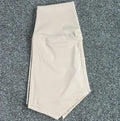 Women's high-waist yoga shorts in nylon fabric, shown in a colour selection including pink litchi and electric blue.