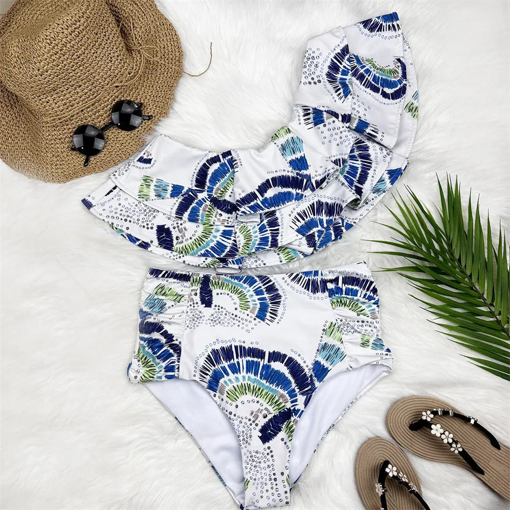 White women's one-shoulder swimsuit with a flounced lotus leaf skirt and high side split.