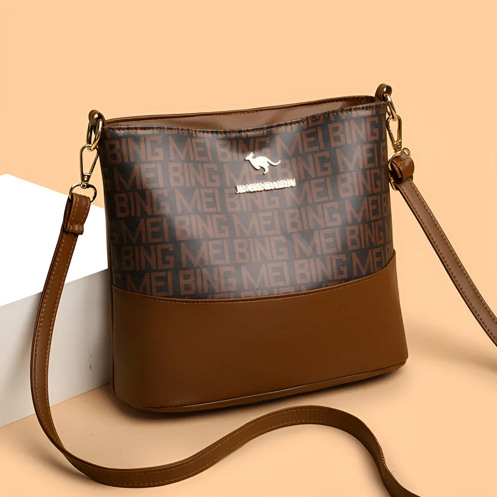 Brown soft PU leather messenger bag with external pocket and organised interior compartments.