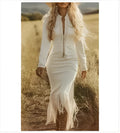 Lady's long-sleeved white tassel dress with fringed hemline on model