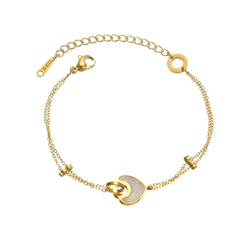 Women's silver stainless steel bracelet with a double-layer red heart charm and magnetic clasp.