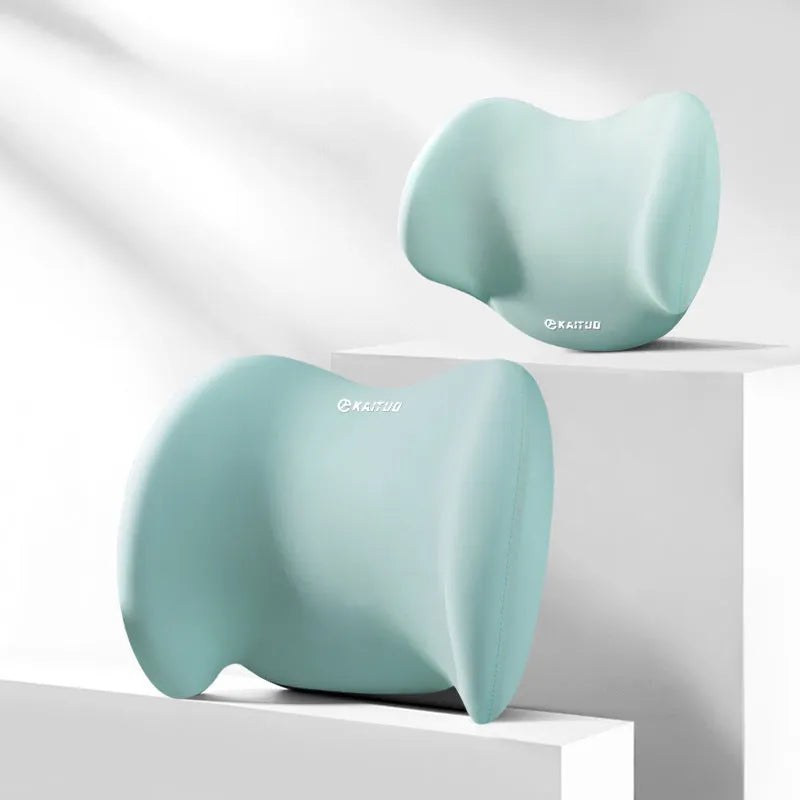 Grey geometric-patterned car headrest pillow and lumbar support cushion set on a car seat.