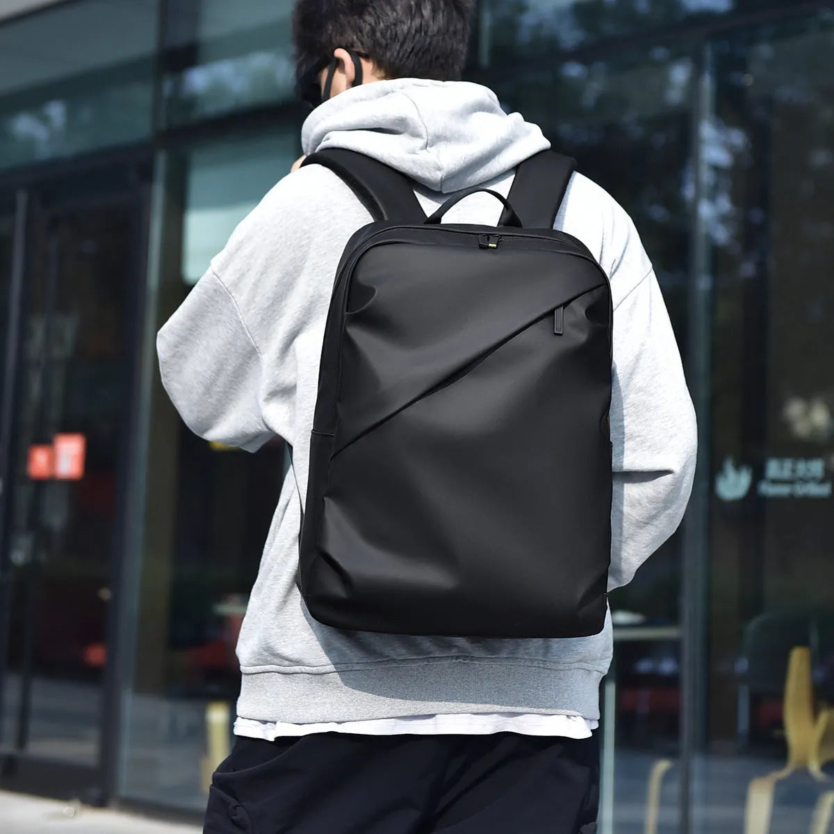 Men's waterproof PU leather backpack in black colour with computer compartment