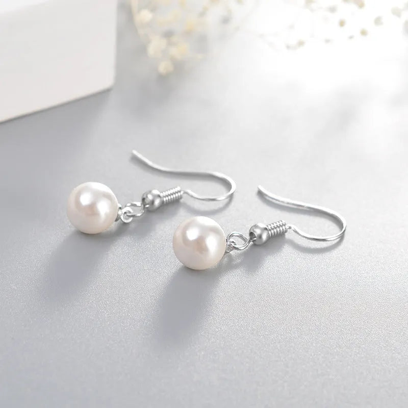 Women's white gold plated geometric high imitation pearl stud earrings on copper base