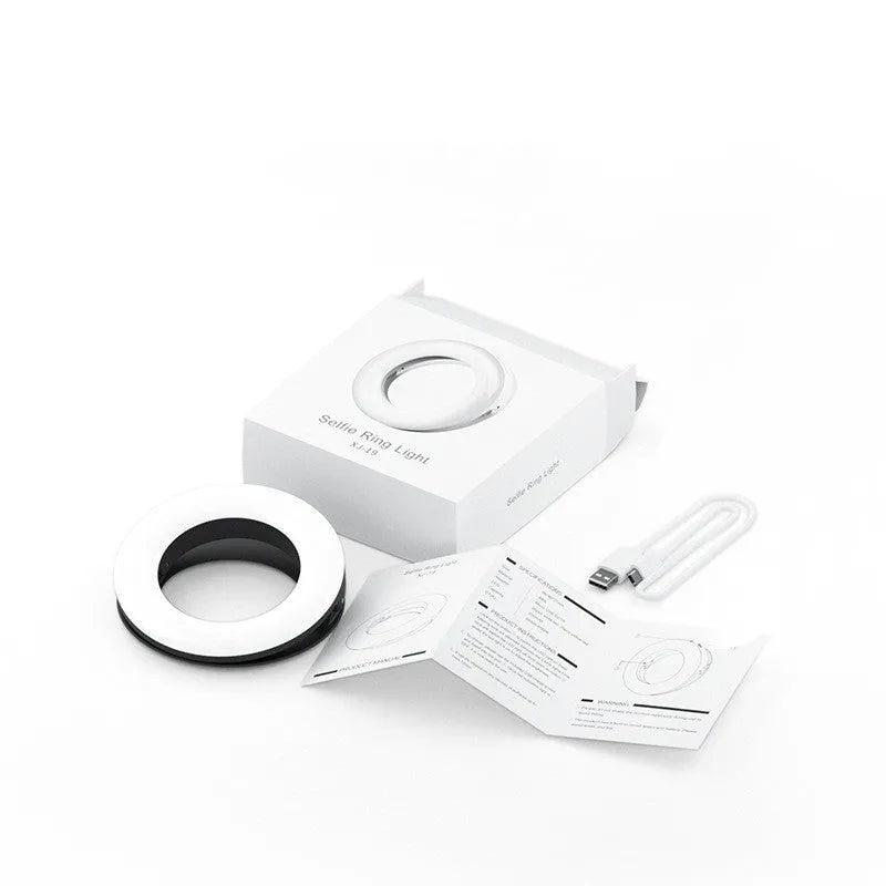 Compact black LED ring light for mobile phone photography with USB cable.