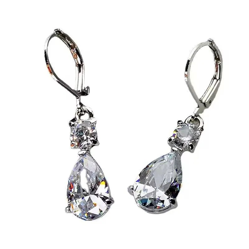White gold drop-shaped long earrings with diamond finish on women