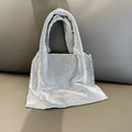 Silver evening handbag with shiny rhinestones and open pocket design made from cotton thread