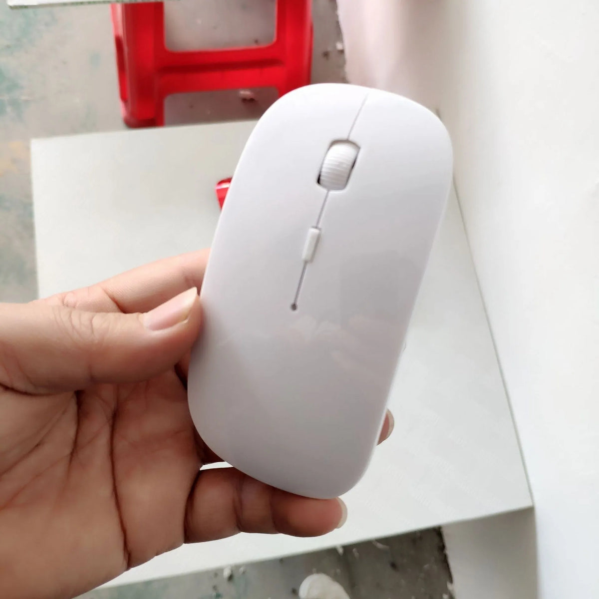 Bluetooth dual-mode wireless mouse in grey with mute buttons and 15cm USB charging cable