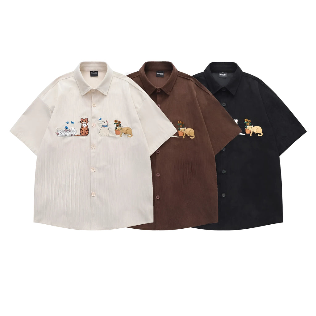 Loose shirt cardigan with embroidered cartoon pattern in apricot, brown, and black colours