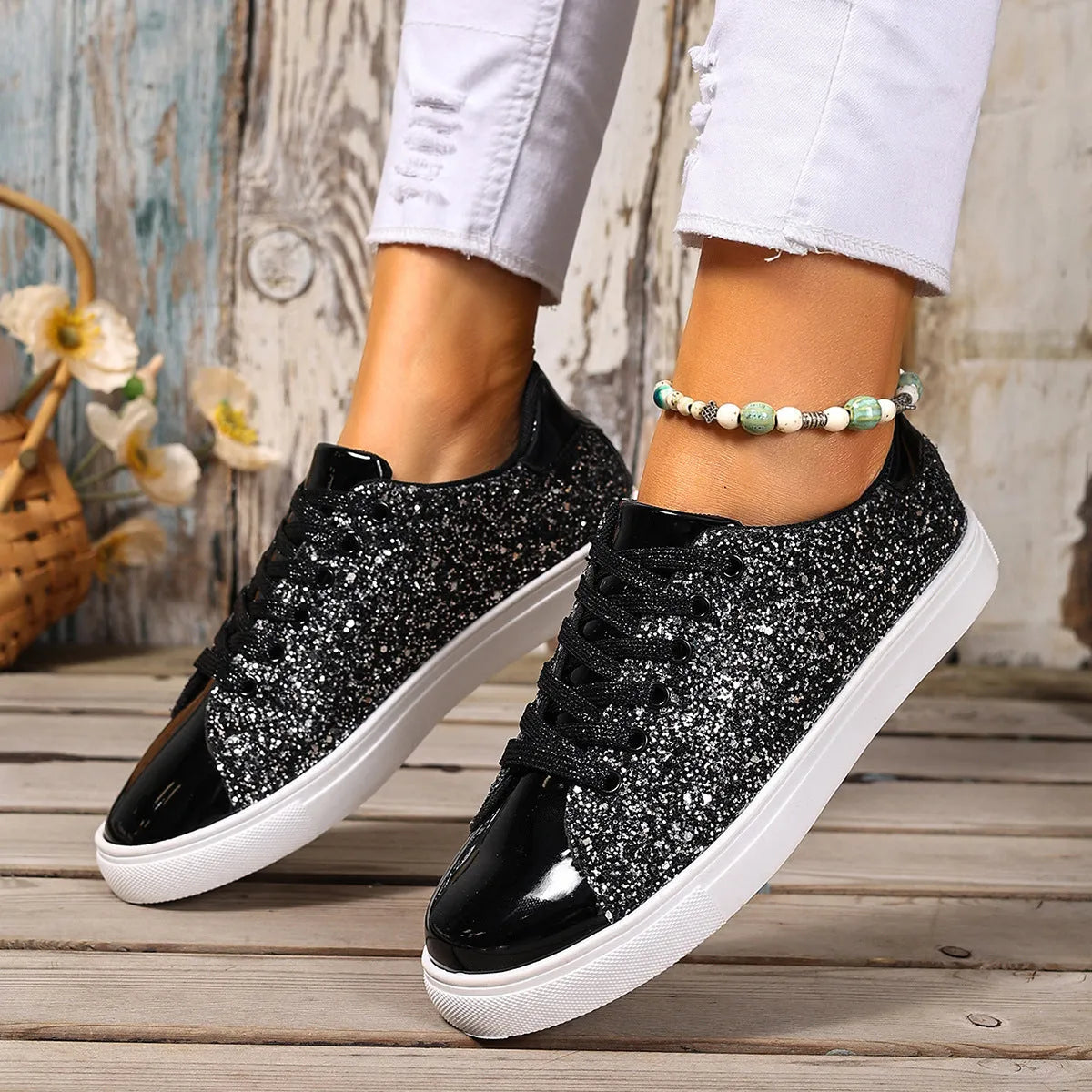 Women's plus size sequinned board shoes with front lace-up closure in black, gold, purple, and silver colour options