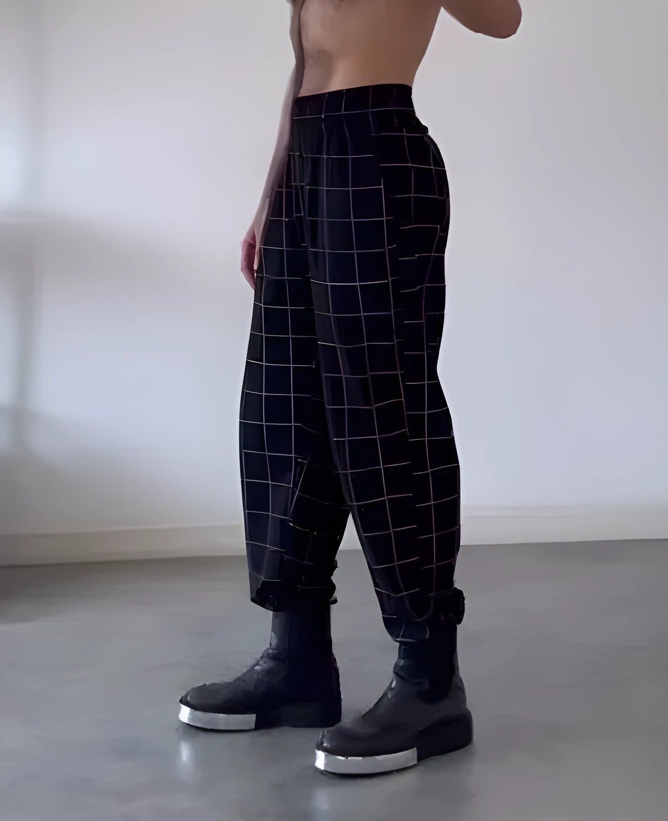 Men's loose-fitting plaid trousers with apron-style front waistband