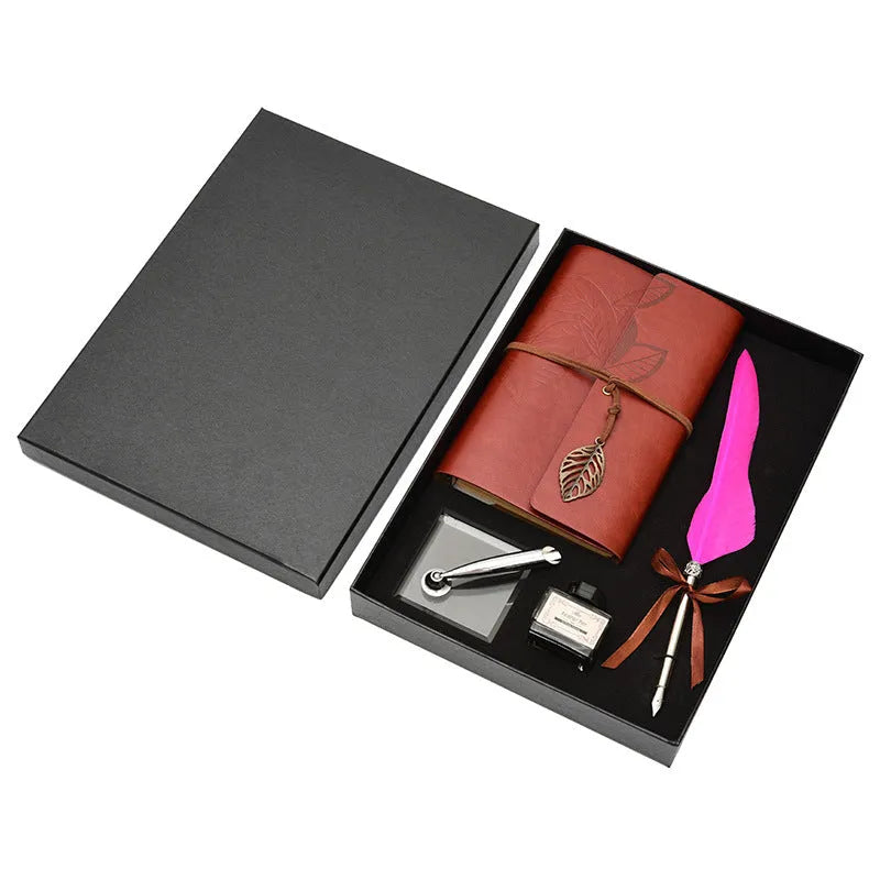 Feather dip pen gift set with copper pen, ink bottle, acrylic base, and antique book in box