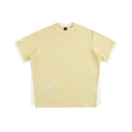 Loose grey waffle-texture T-shirt with embroidered retro alphabet design on the front.