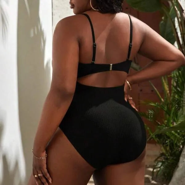 Plus size women's black sling triangle one-piece swimsuit with polyester and spandex stretch fabric