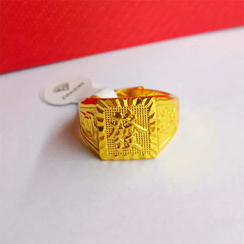 Square men's alloy ring with electroplated yellow finish on plain background