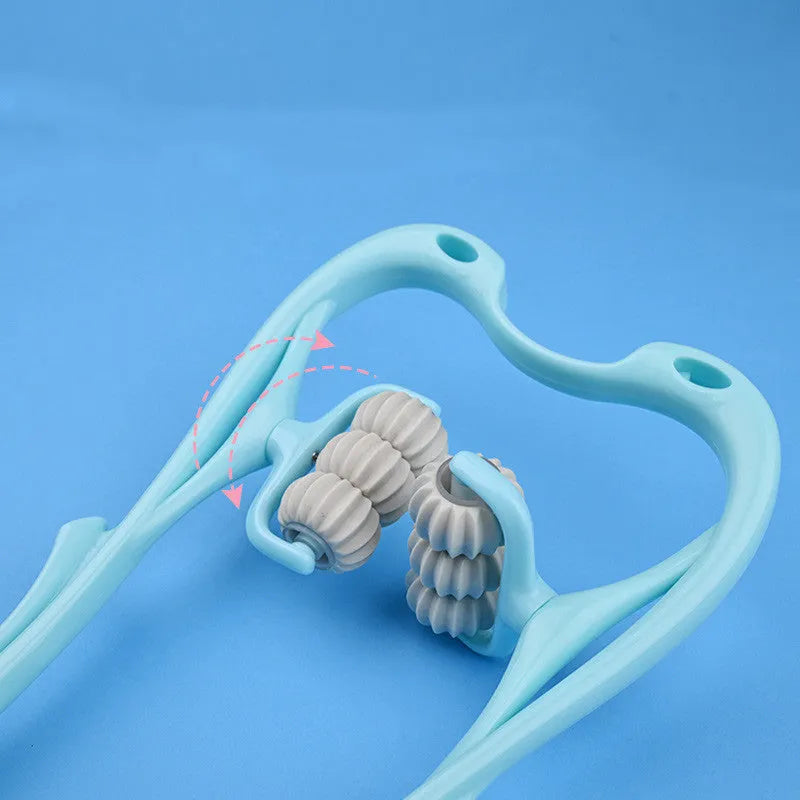 Blue swan-shaped manual six-wheel neck massager with rotating balls and a white crystal jade scraping board on a table.