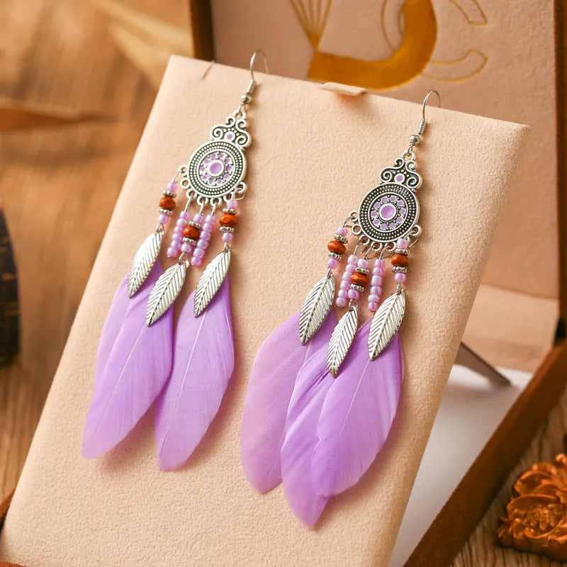 Bohemian style round drop feather earrings with leaf design in alloy, showing electroplated finish.