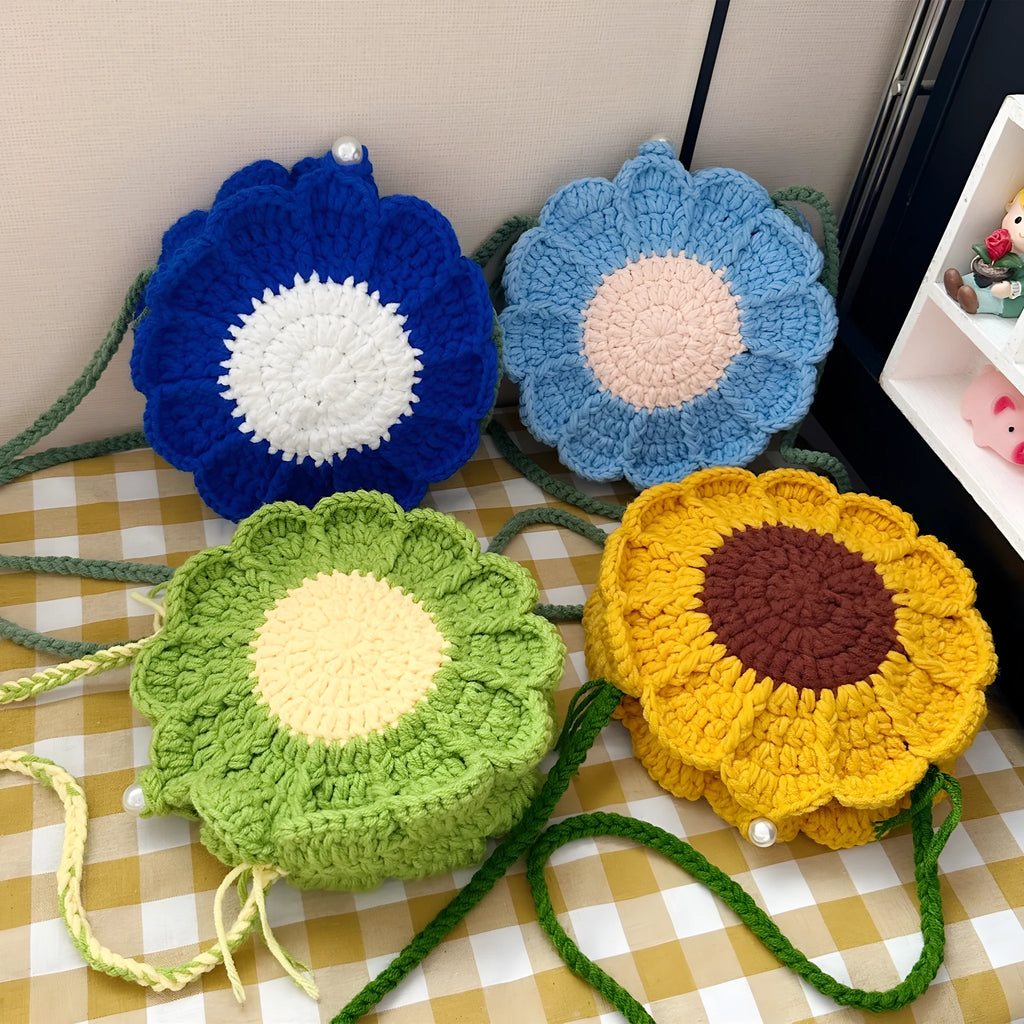 Hand-woven crochet shoulder bag with wool flowers and round suitcase shape