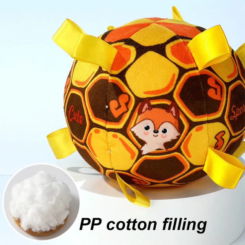Green plush ball dog toy with a handle and internal bells, 15cm in diameter.