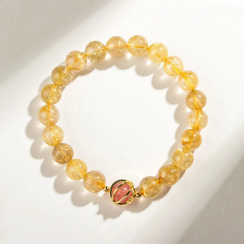 Natural citrine and gold rutilated quartz crystal bracelet with diamond-shaped beads