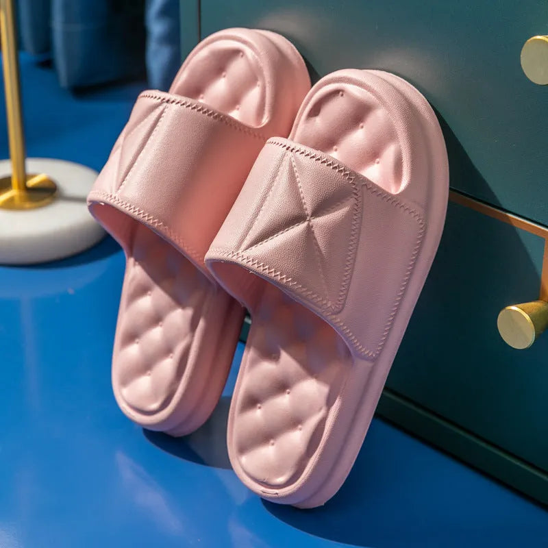 A pair of soft EVA bathroom slippers with a thick sole, shown in a choice of colours including black, caramel, green, pink, and yellow.