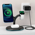 Black three-in-one magnetic wireless charger with iPhone, Apple Watch, and AirPods case placed on charging pads